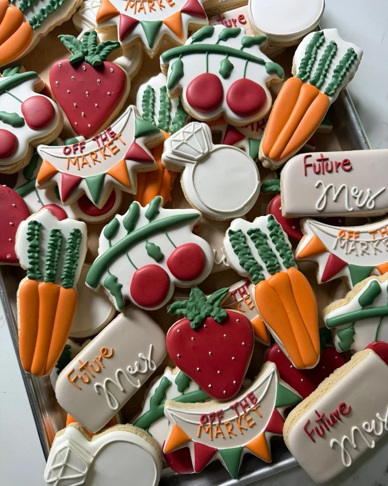 A custom cookie set with fruit and garden shapes.