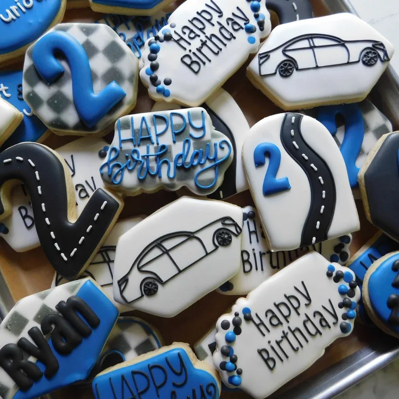 Race car and checkered-flag cookies for a second birthday.