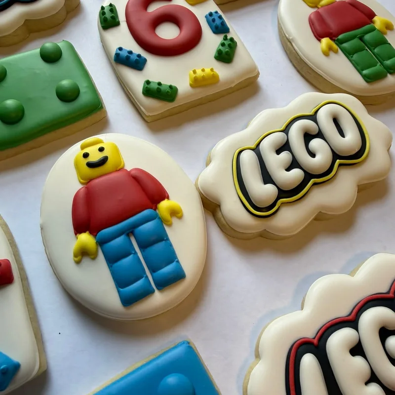 Building-brick minifigure cookies and a brick logo.