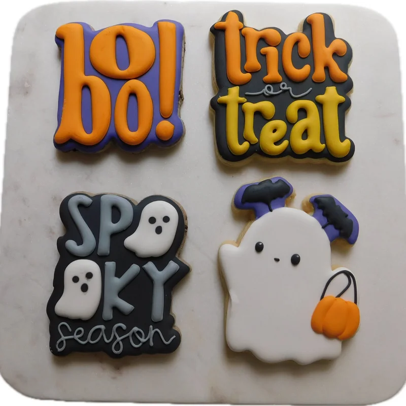Halloween cookies reading boo, trick or treat, and spooky season with a ghost.
